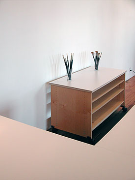 Extra large art storage shelves and work surface for storing flat art in the art studio, and classroom.