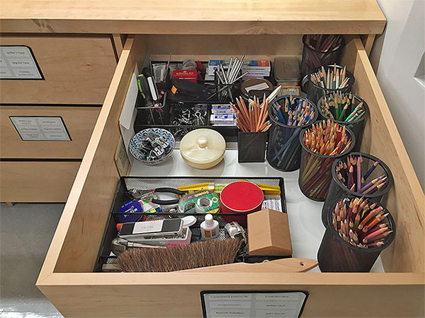 Art studio drawing materials are stored, organized, and labeled in the top art storage drawer. Ready for students to use in art school drawing classes.