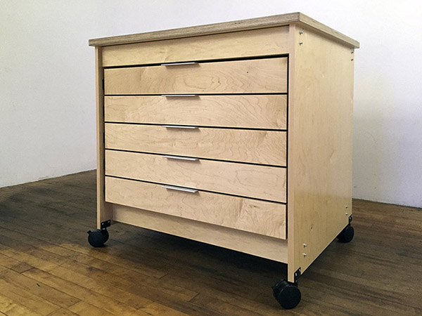 Artist Studio Art Storage Drawers made by Art Boards™ for storing watercolor paintings and painting supplies.  Art Boards™ art studio storage drawers roll on wheels that lock in place. Art Boards™ mobile Art Studio furniture has five drawers. The inside measurements of the drawers are 37" wide, 31" deep, 4" in height. Made in Brooklyn New York, by Art Boards™ Archival Art Supply, USA. 11217.