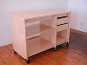Art Storage Desk and Work Table is on wheels that lock with 2 art storage drawers.