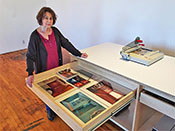 Photography classroom desk doubles as a worktable in the school photo studio room. Furniture drawers fully extend to store and organize teaching materials.