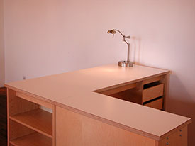 Art Studio Desk with shelves and drawers for storing and making art.