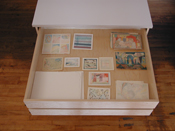 Water color paintings are stored in the Art Storage System cabinet drawers.