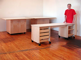 Artist Desks with drawers and shelving are pare of the art storag e