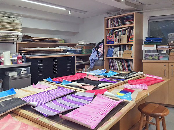 Art classroom has collage table, book shelves for art books, and art work counters over standard flat files. All the furniture is made in Brooklyn by Art Boards™ Archival Art Supply.