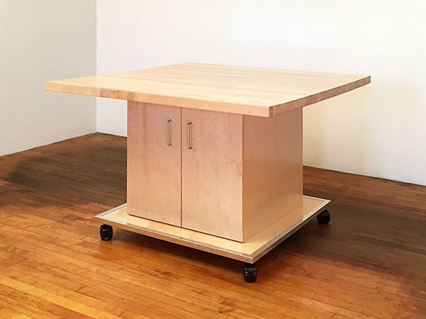 Art Boards™ Art Studio Work table has a thick 1.5" maple butcher block top and a rolling art studio storage cabinet below. This art work table is a mobile work station that rolls on wheels that are all locking. All art studio furniture is designed, made, and shipped by Art Boards™ in Brooklyn, New York, 11217. Fabricated for the school art classroom, and for artists studios.