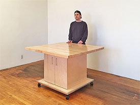 The Art Studio Table is 32" in height, the top is 1.5" thick and made of maple hardwood, and the table rolls on locking wheels. Art Studio Furniture is designed by Art Boards™ for artists, art class rooms, and offices. All products are proudly made in Brooklyn, New York, USA.