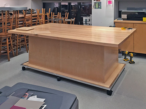 Photography classroom furniture has ample storage below the 48" x 96" maple hardwood butcher block working surface.