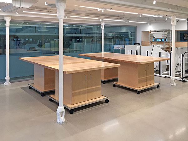 Two 48" x 96" Art Room work tables are located in the school mezzanine floor. They separate into smaller 4' x 4' tables or can be made as long as 4' x 16', 4' by 12', or 8' x 8'. All wheels on the Art Studio Tables are locking. Each table has adjustable storage shelving below.