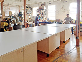 Large library work tables for schools, and art studios. Made in Brooklyn by Art Boards™ with oversized 5’ x 5’ laminate tables tops allowing students to stand or sit while spending time in the library doing their projects, and studying.