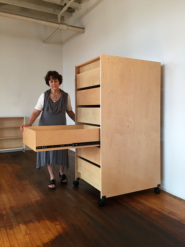 Art Conservators Furniture on locking wheels have seven deep mobile art studio drawers for the well organized book bindery and restoration studio. Made by Art Boards™ Archival Art Supply.The 