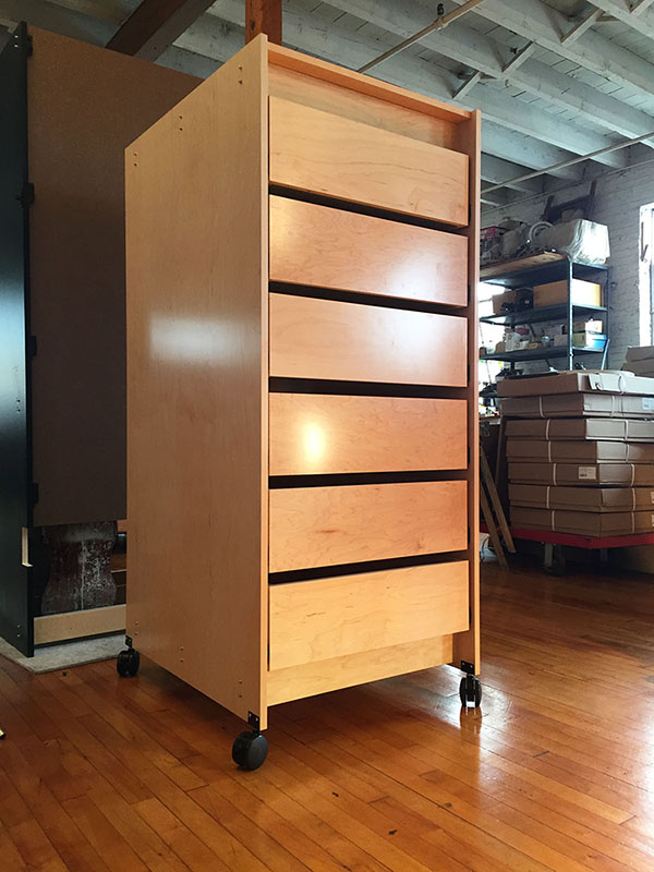 Mobile art preservation furniture is made in Brooklyn by Art Boards™ Archival Art Supply. It has 7 drawers to access and organize paints, pigments, art cleaning agents, archival restoration supplies, and archival art materials.