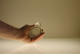 Muller held in the hand showing the 3 inch diameter base.