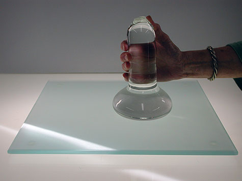 To hand-mull paint well, you will need a large glass muller and glass slab.