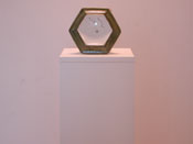 Ceramic sculpture displayed on an Art Boards wood sculpture base.